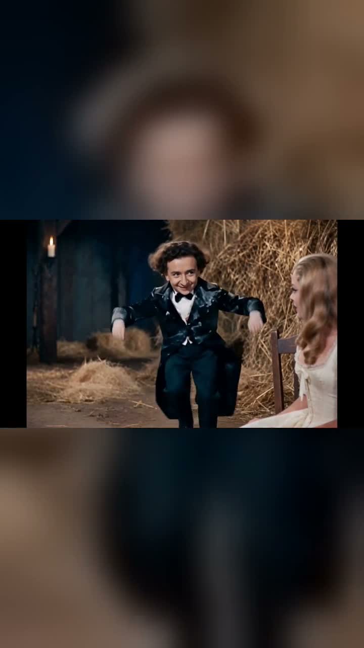 Cover of a generated Rumpelstiltskin AI video showing a dancer in a dark formal outfit and a seated blonde princess beside straw
